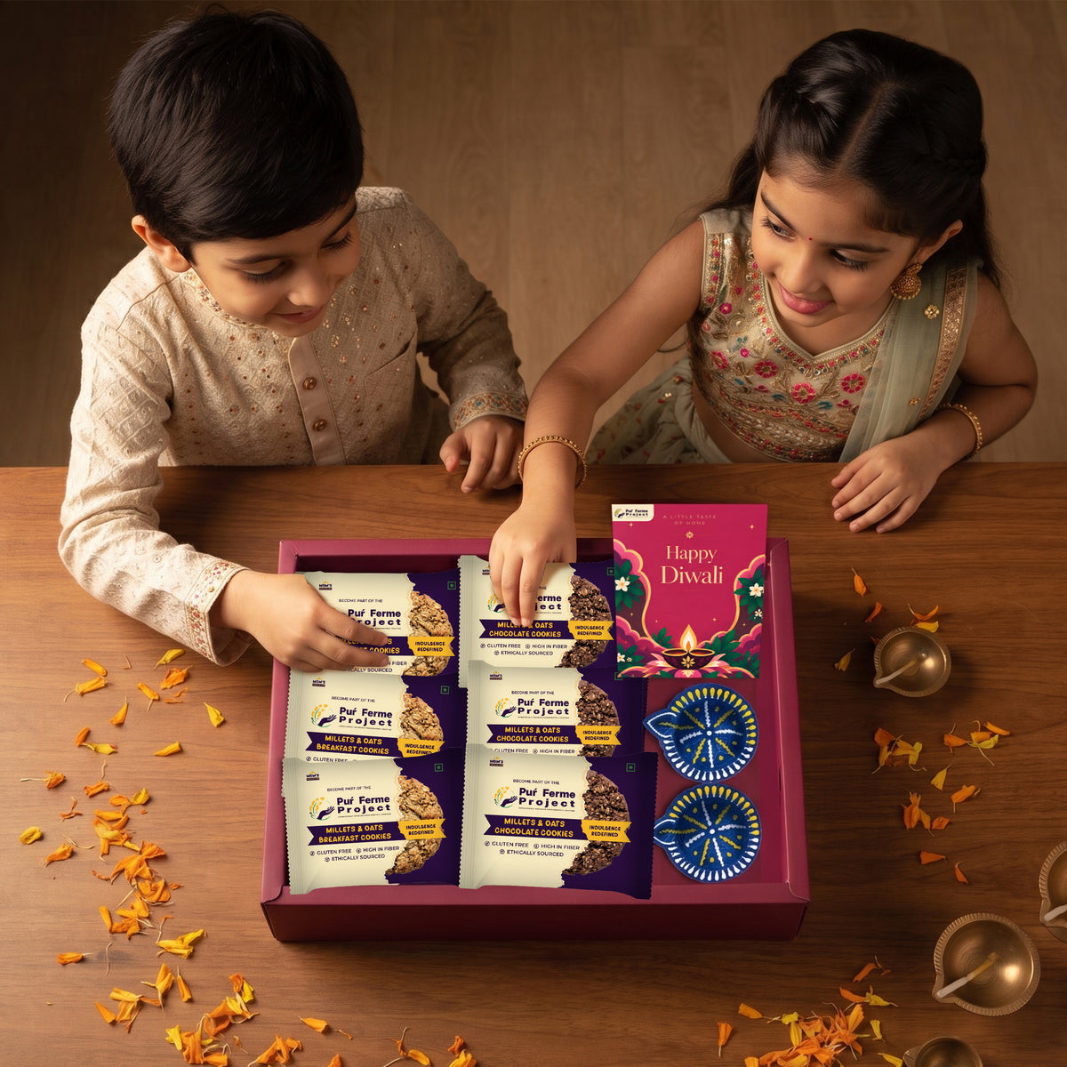 Puŕ Ferme Project Diwali Gift Box – Millet & Oats Cookies, Diyas & Greeting Card
